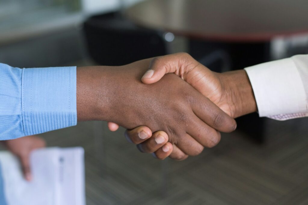 two african american men shaking hands